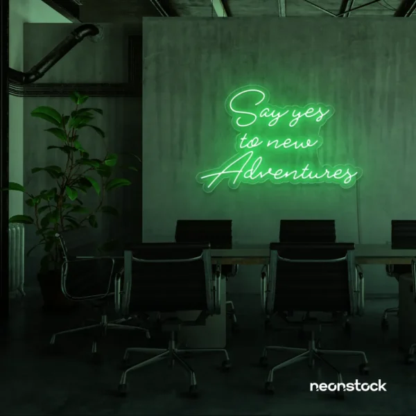Say Yes to New Adventures neon sign in green for travel decor, modern entryways, and motivational vibes.