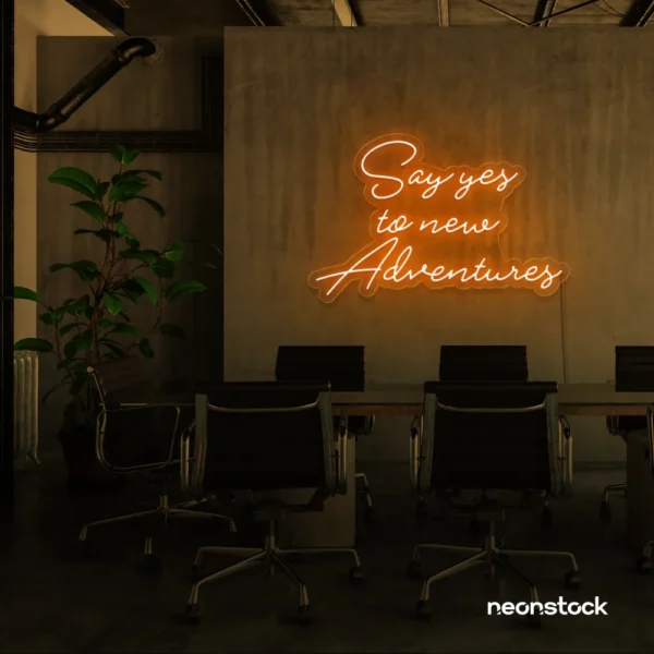 Say Yes to New Adventures neon sign in orange for travel decor, modern entryways, and motivational vibes.