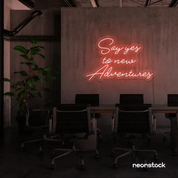 Say Yes to New Adventures neon sign in peachy pink for travel decor, modern entryways, and motivational vibes.