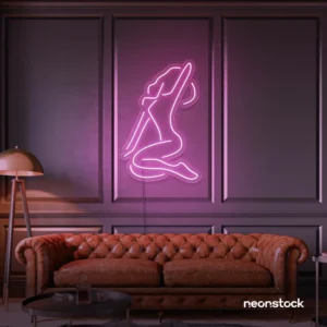 Sitting woman neon sign in baby pink for minimalist wall art and feminine home decor.
