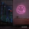 Smiley face neon sign in baby pink for home or kids room wall decor