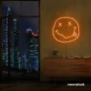 Smiley face neon sign in orange for home or kids room wall decor