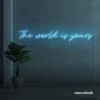 The World Is Yours neon sign in ice blue for visionary decor, inspiring spaces, and modern walls.