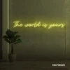 The World Is Yours neon sign in lemon yellow for visionary decor, inspiring spaces, and modern walls.