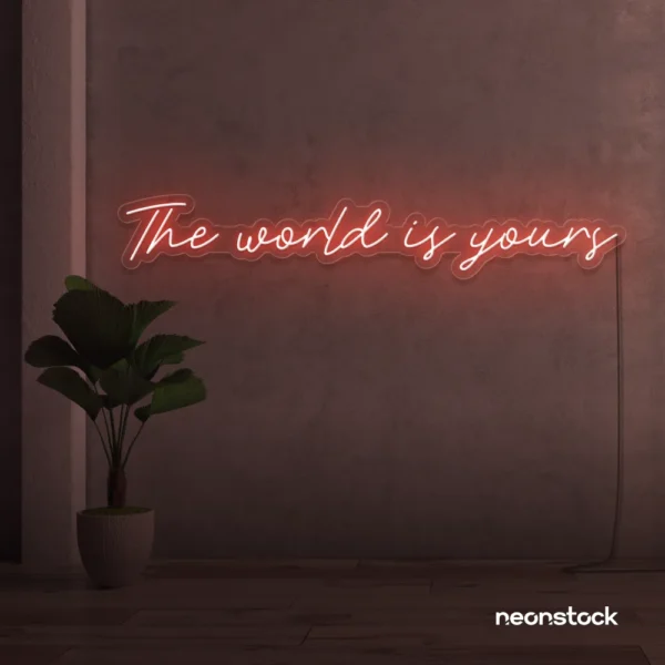 The World Is Yours neon sign in peachy pink for visionary decor, inspiring spaces, and modern walls.