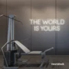 The World Is Yours neon sign in neutral white for empowerment decor, teen rooms, and motivational walls.