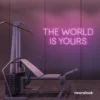 The World Is Yours neon sign in baby pink for empowerment decor, teen rooms, and motivational walls.