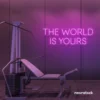 The World Is Yours neon sign in pink for empowerment decor, teen rooms, and motivational walls.