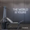 The World Is Yours neon sign in white for empowerment decor, teen rooms, and motivational walls.