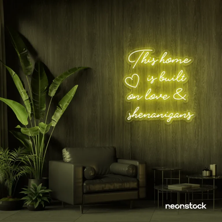 This Home Is Built on Love and Shenanigans neon sign in golden yellow for family walls, living rooms, and cozy decor.