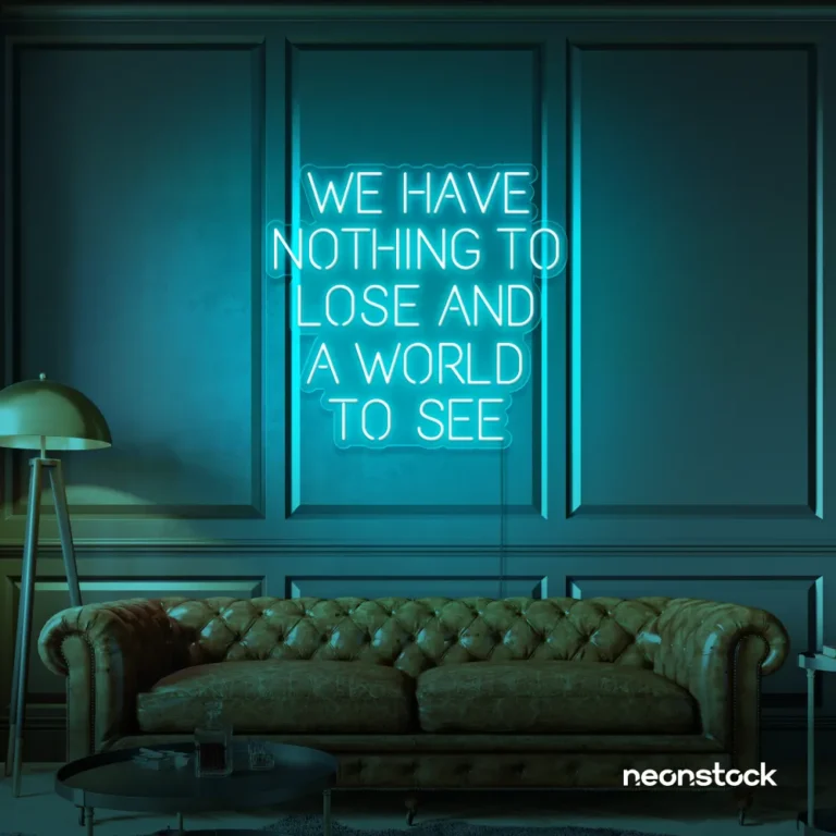 We Have Nothing to Lose and a World to See neon sign in mint green for travel wall art and decor lovers.