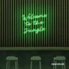 Welcome to the Jungle neon sign in green for bold interiors, gaming setups, and tropical decor.
