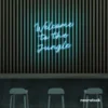Welcome to the Jungle neon sign in ice blue for bold interiors, gaming setups, and tropical decor.
