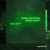 When Nothing Goes Right Go Left neon sign in deep green for motivational spaces and creative rooms.
