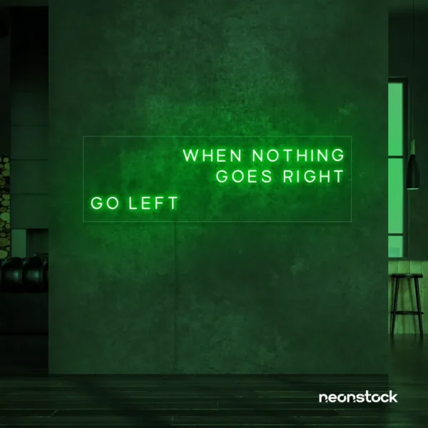 When Nothing Goes Right Go Left neon sign in deep green for motivational spaces and creative rooms.