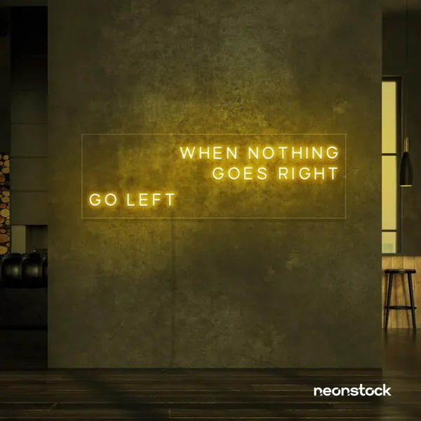 When Nothing Goes Right Go Left neon sign in golden yellow for motivational spaces and creative rooms.