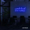 Work Hard Stay Humble neon sign in dark blue for success-driven decor, workspaces, and personal growth rooms.