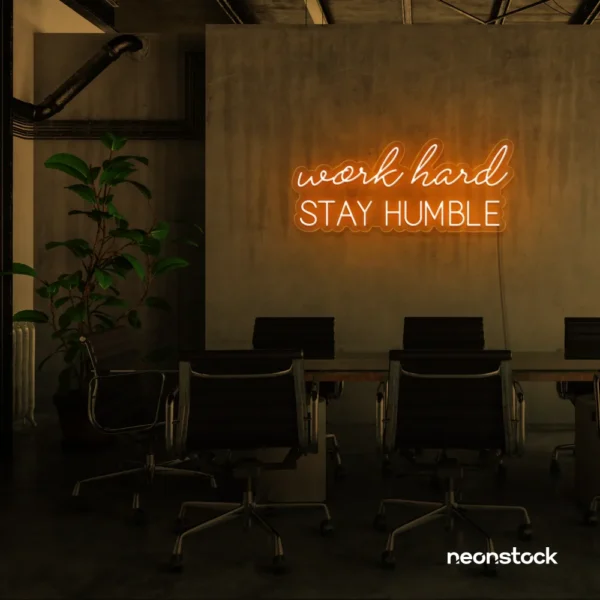 Work Hard Stay Humble neon sign in orange for success-driven decor, workspaces, and personal growth rooms.