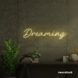 Dreaming neon sign in warm white for dreamy decor, teen bedrooms, and relaxing nooks.
