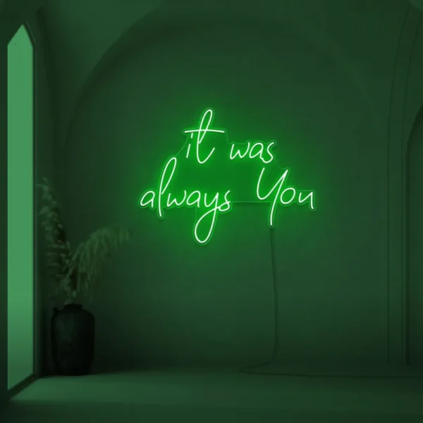 Neon sign text 'It Was Always You' in deep green for weddings and romantic events