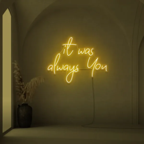 Neon sign text 'It Was Always You' in golden yellow for weddings and romantic events