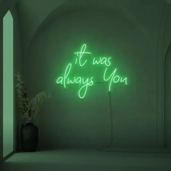 Neon sign text 'It Was Always You' in green for weddings and romantic events