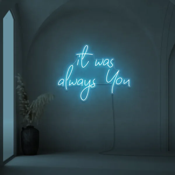 Neon sign text 'It Was Always You' in ice blue for weddings and romantic events