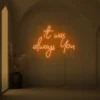 Neon sign text 'It Was Always You' in orange for weddings and romantic events