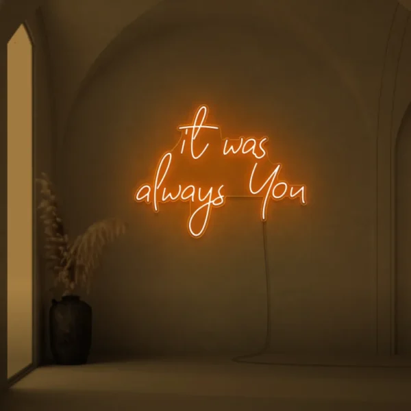 Neon sign text 'It Was Always You' in orange for weddings and romantic events