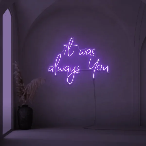 Neon sign text 'It Was Always You' in purple for weddings and romantic events