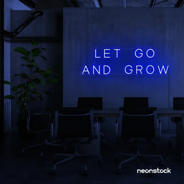 Let Go and Grow neon sign in dark blue for growth mindset decor, wellness rooms, and modern inspiration walls.
