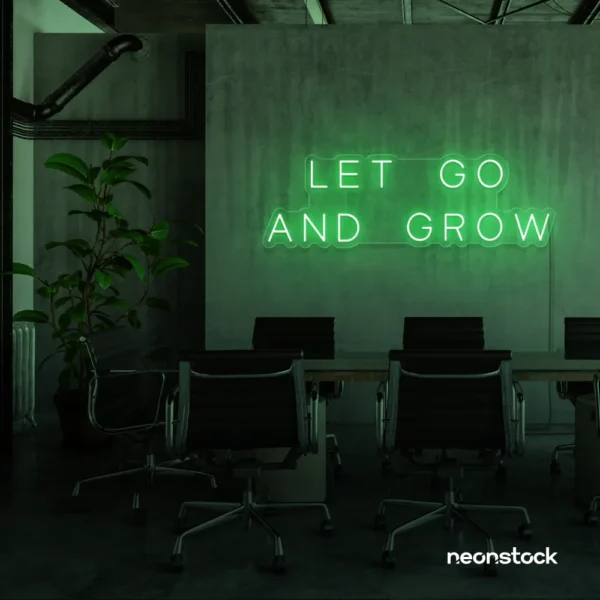Let Go and Grow neon sign in green for growth mindset decor, wellness rooms, and modern inspiration walls.