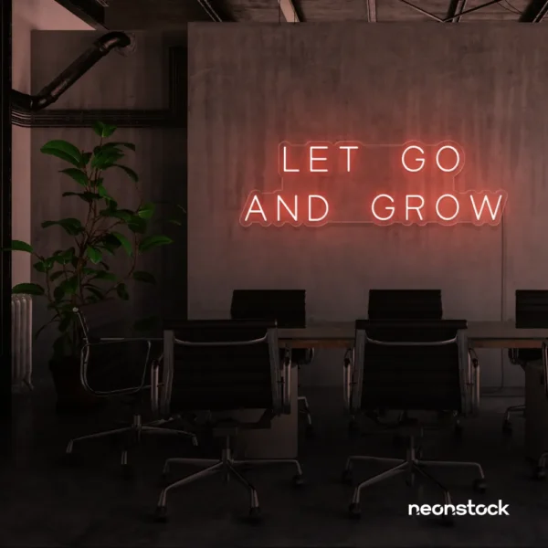 Let Go and Grow neon sign in peachy pink for growth mindset decor, wellness rooms, and modern inspiration walls.
