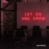 Let Go and Grow neon sign in red for growth mindset decor, wellness rooms, and modern inspiration walls.