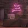Rise and Grind neon sign in baby pink for gym walls, hustle rooms, and motivational office decor.