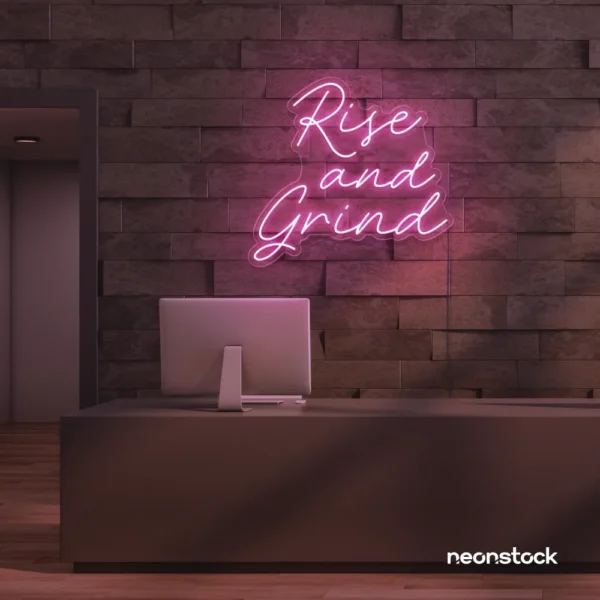 Rise and Grind neon sign in baby pink for gym walls, hustle rooms, and motivational office decor.
