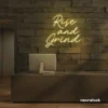 Rise and Grind neon sign in dark blue for gym walls, hustle rooms, and motivational office decor.