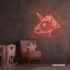 Unicorn neon sign in peachy pink for kids' bedrooms, fairy-tale decor, and magical playrooms.